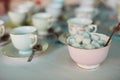 Its all about how many cubes you take with tea. Closeup shot of tea cups laid out on a table at a tea party inside. Royalty Free Stock Photo