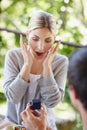 Its beautiful. a beautiful young woman looking surprised as her boyfriend is proposing. Royalty Free Stock Photo