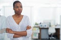 Its been a hard day at work. a young business woman standing with her arms crossed. Royalty Free Stock Photo