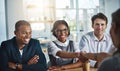 Its been a pleasure doing business with you. two young businesspeople shaking hands during a meeting in the boardroom. Royalty Free Stock Photo