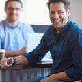 Its been a productive day. Portrait of a two colleagues having a talk over coffee in an office. Royalty Free Stock Photo