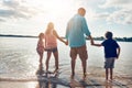 Its the best way to cool off and have some fun. a beautiful family spending some quality time on the beach. Royalty Free Stock Photo