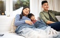 Its the best way to spend the weekend with family. a family watching television together at home. Royalty Free Stock Photo