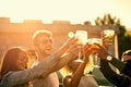 Its better having great friends instead of a ton. a group of young friends having a drink and spending the day outside