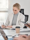 Its better to be alone than in bad company. a young business woman working in a office. Royalty Free Stock Photo