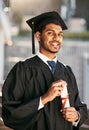 Its the biggest reward after years of hard work. Portrait of a student holding his diploma on graduation day. Royalty Free Stock Photo