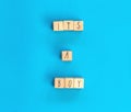 Its a Boy text written with wooden cubes with pastel blue background, Baby Shower or Nursery background Baby announcement. Flat
