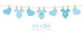 Its a boy welcome greeting card for childbirth with hanging hearts and bodysuits Royalty Free Stock Photo