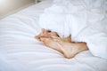 Its so cozy being in bed with you. a couples feet as they lay in bed together. Royalty Free Stock Photo