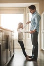Its a daddy-daughter kind of day. a happy father dancing with his little girl in the kitchen at home. Royalty Free Stock Photo