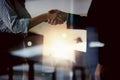 Its a deal. Closeup shot of two businesspeople shaking hands in an office. Royalty Free Stock Photo