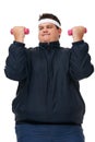 Its a deep burn. A studio shot of an obese man lifting weights and exerting himself.