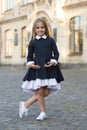 Its easy to be nice if you feel comfortable. Small kid wear uniform outdoors. Back to school style. Fashion schoolwear