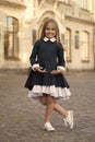 Its easy to be nice if you feel comfortable. Small kid wear uniform outdoors. Back to school style. Fashion schoolwear