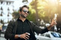 Its easy to find a taxi in the city. a handsome young man hailing a cab in the city. Royalty Free Stock Photo