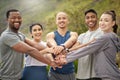 Its an exciting journey that were on. Portrait of a group of sporty young people joining their hands together in a Royalty Free Stock Photo