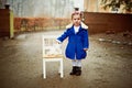 Its fine my teddy can have my seat. an adorable little girl holding her teddy outdoors. Royalty Free Stock Photo