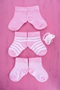 Its a Girl Baby Shower or Nursery concept with socks on pink woo Royalty Free Stock Photo