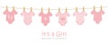 Its a girl welcome greeting card for childbirth with hanging baby bodysuits Royalty Free Stock Photo