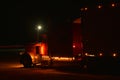 Classic Semi Truck Hauls Refrigerated Cargo Under the Night Lights