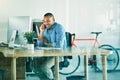 Its going great. a handsome young businessman making a phonecall while working in his office. Royalty Free Stock Photo