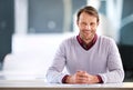 Its always a good day to do business. Portrait of a mature businessman sitting at a desk in an office. Royalty Free Stock Photo