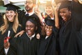 Its graduation time and everyone is so excited. a group of cheerful university students on graduation day. Royalty Free Stock Photo