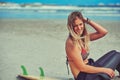 Its a great day for some waves. a beautiful young woman going for a surf at the beach. Royalty Free Stock Photo