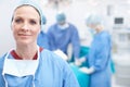 Its a great day to save lives. Portrait of a happy mature woman wearing hospital scrubs in an operating theatre during a Royalty Free Stock Photo