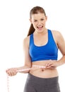 Its great seeing the results. A pretty teenage girl measuring her waistline and looking happy. Royalty Free Stock Photo