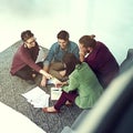 Its important to make choices together when in a team. a group of young creatives having a meeting in a modern office.