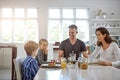 Its important to start your day with breakfast. a family having breakfast together.