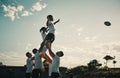 Its only a matter of milliseconds before he catches it. a handsome young rugby player catching the ball during a lineout