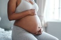 Its 9 months but the joys of motherhood lasts forever. Closeup shot of an unrecognisable woman touching her pregnant Royalty Free Stock Photo