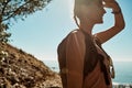 Its the most beautiful view Ive ever seen. a young woman admiring the view from the top of a mountain. Royalty Free Stock Photo