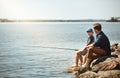 Its so much fun fishing with you, Dad. a father and his little son fishing together. Royalty Free Stock Photo