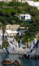 Rock cliff houses at Cala Feola bay on Ponza Island in Italy Royalty Free Stock Photo