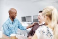 Its nice to have office friends. Three business colleagues talking in an informal meeting together. Royalty Free Stock Photo