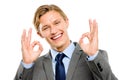 Its perfect in every sense. A handsome young businessman standing alone in the studio and showing an okay sign. Royalty Free Stock Photo