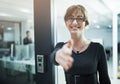 Its a pleasure to finally meet you. Portrait of a young businesswoman offering you her hand while standing in an office