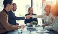 Its always a plus to extend your business network. businesspeople shaking hands during a meeting in an office.