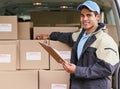 Its about providing a fast and first-rate service. Portrait of a delivery man standing next to a van full of boxes.