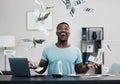 Its raining money. Shot of a young businessman managing his money at home. Royalty Free Stock Photo