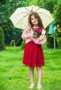 Its rainy weather. small girl hold kitten. kid love her pet. human and animals. love and care. fluffy cat in hand of