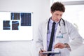 Its save a life o clock. a male doctor checking the time. Royalty Free Stock Photo