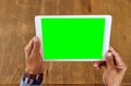 Its a simple connection to the world. Closeup shot of an unrecognizable senior man holding a digital tablet with a green Royalty Free Stock Photo