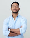 Its simply a matter of confidence. Portrait of a confident young businessman standing with his arms crossed against a Royalty Free Stock Photo