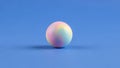 Its spherical shape casts a subtle shadow on the blue surface emphasizing its Royalty Free Stock Photo