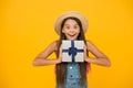 Its time for surprise. Happy girl hold gift yellow background. Surprise box. Surprised look of little child. Birthday Royalty Free Stock Photo