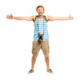 Its time to explore the world. Full length shot of a handsome young tourist standing alone in the studio with his arms Royalty Free Stock Photo